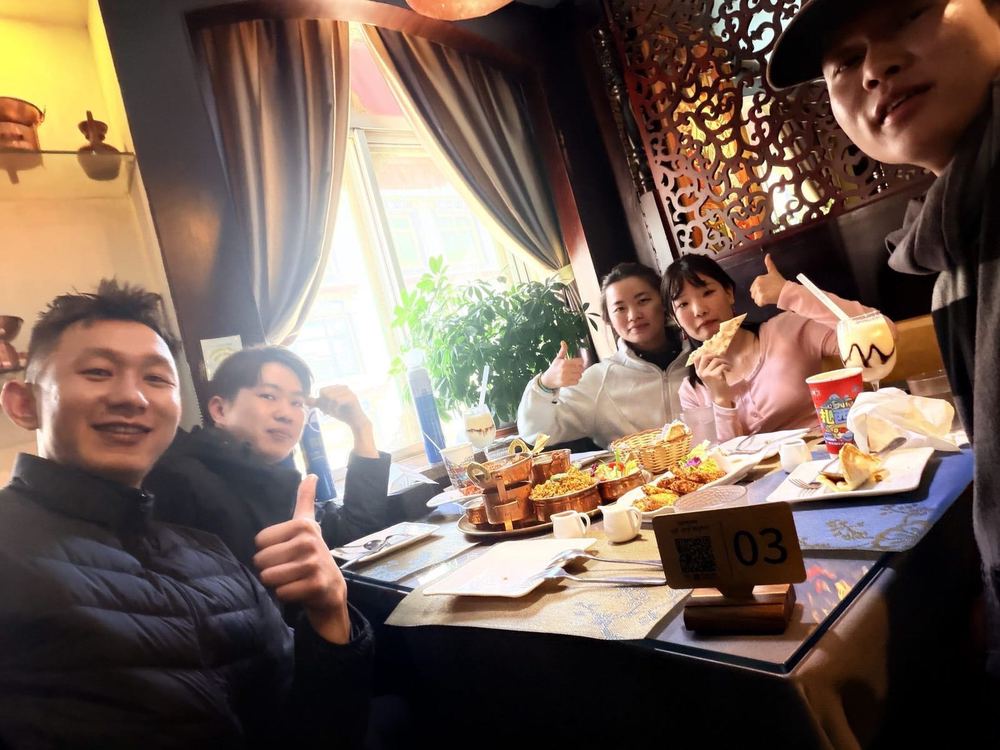 Sweet tea and a shared table with fellow travelers at a Tibetan teahouse in Lhasa